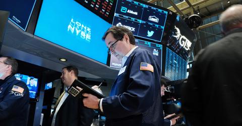 Stock market trader looking at data