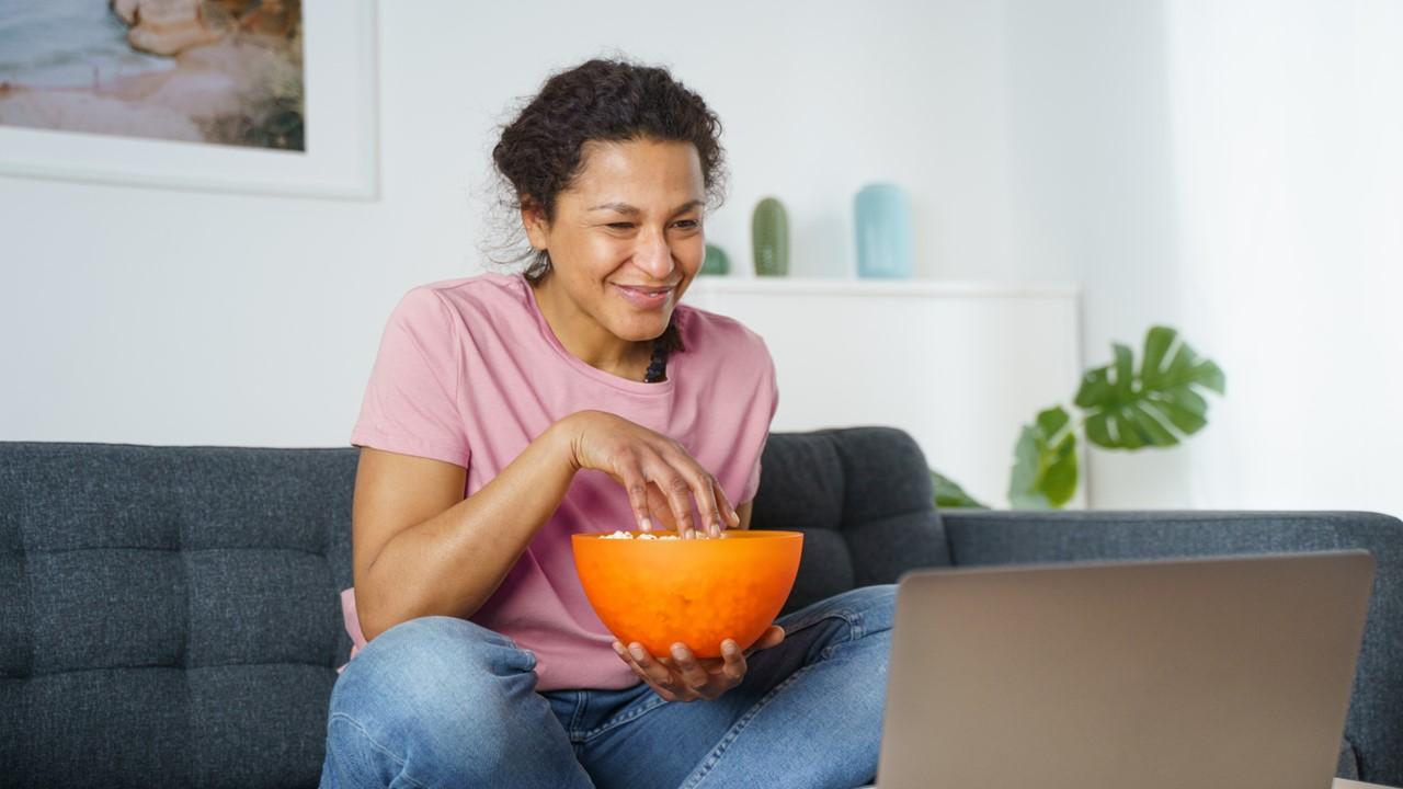 A woman using a free trial on a laptop