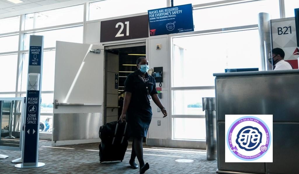 A Delta Air Lines flight attendant walking in an airport