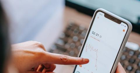 A person checking stocks on their phone