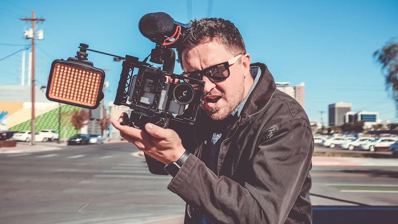 A man recording footage on his camera