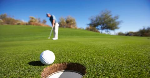 Man hitting a golf ball