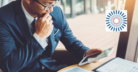 Man studying data and Allakos logo