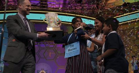 Harini Logan receiving the Scripps National Spelling Bee trophy