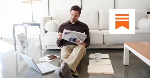 Man reading a newspaper and Substack logo