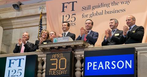 Staff at the Financial Times ring the bell at the New York Stock Exchange