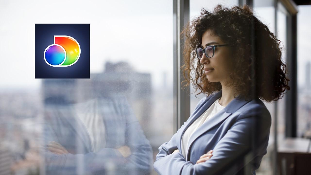 Woman looking out a window and Discovery logo