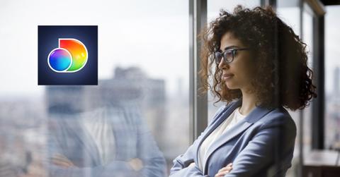 Woman looking out a window and Discovery logo