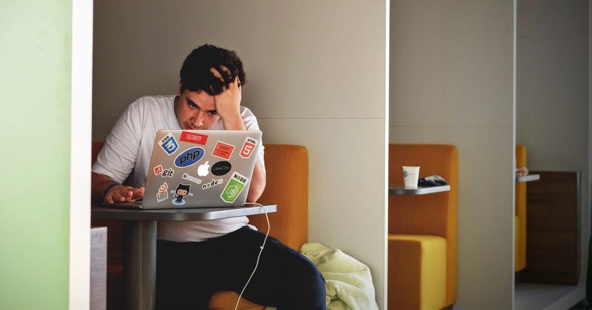 College student looking on a laptop