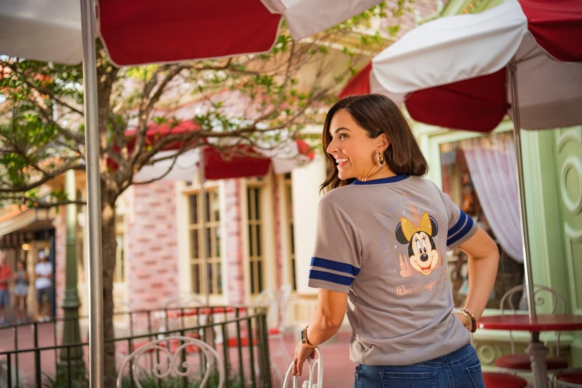 A woman wearing a Disney shirt