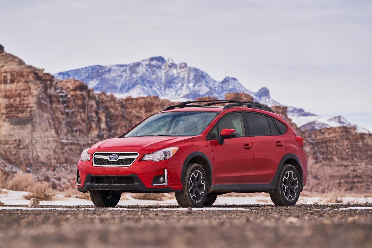 A Subaru in a rocky terrain. 