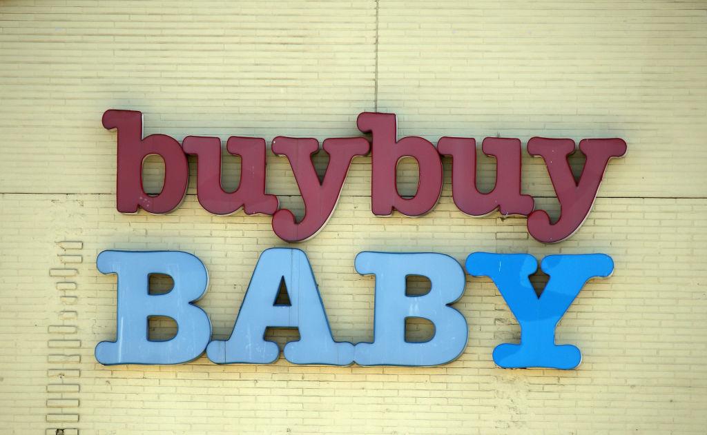 A buybuy Baby store sign on yellow brick