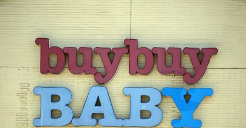 A buybuy Baby store sign on yellow brick