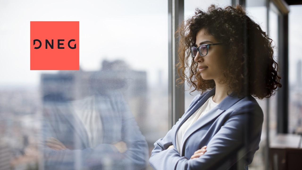 Woman looking out a window and DNEG logo