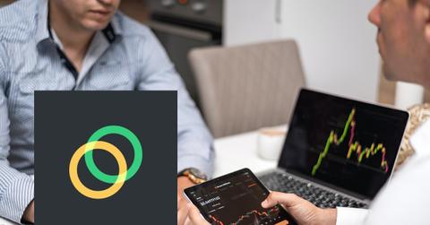 People looking at crypto price charts on devices