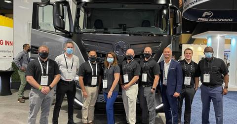 Nikola employees posing with a truck