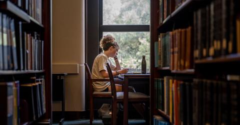 College student studying in library