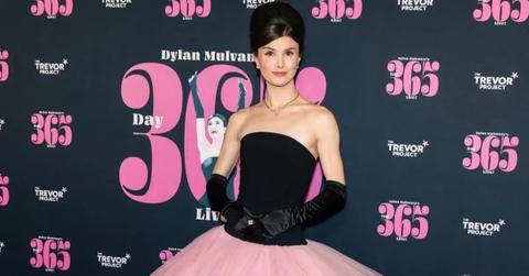 Dylan Mulvaney in a black and pink dress celebrating 365 days of girlhood.