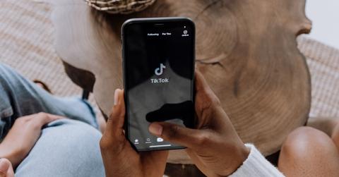 person opening tiktok app on phone