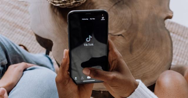 person opening tiktok app on phone
