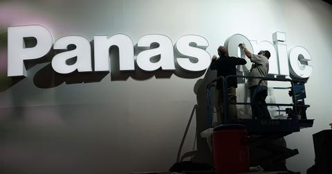 People hanging Panasonic sign