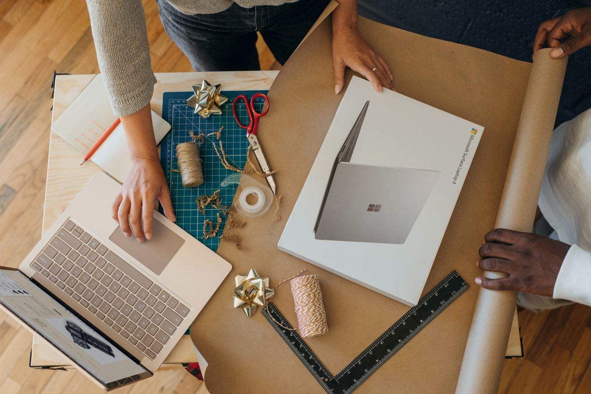 A woman unpacks her Microsoft Surface Pro laptop