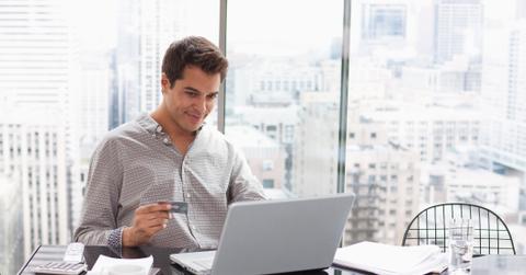 A person buying something online with a credit card