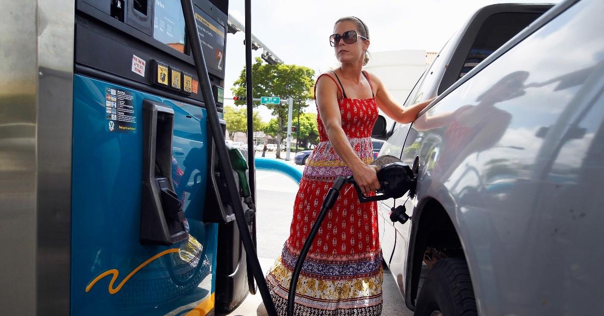 Woman pumping gas