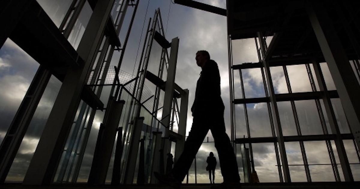 A person walking amid scaffolding