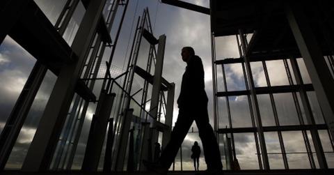 A person walking amid scaffolding