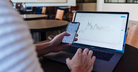 Businessman checking stock market graph