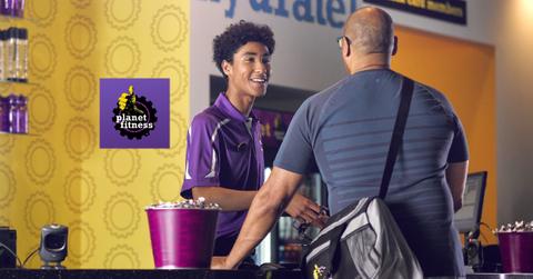 Planet Fitness staff helping a member