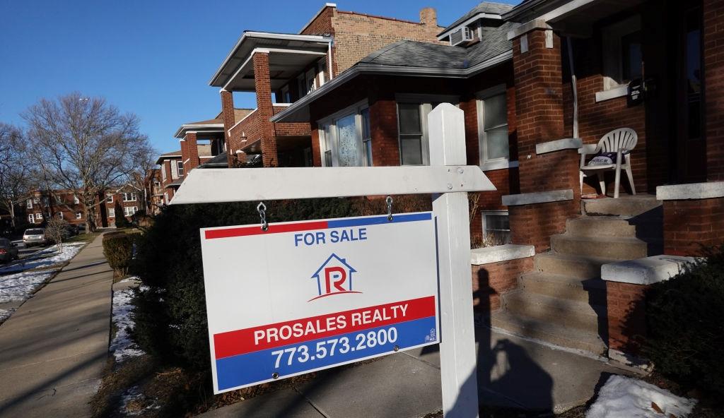 For sale sign outside of townhome