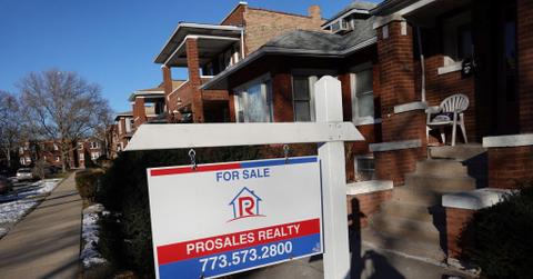 For sale sign outside of townhome