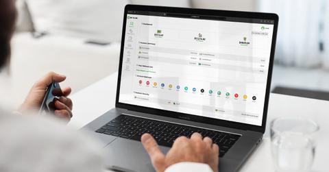 A person completing a BitPlam application on a laptop