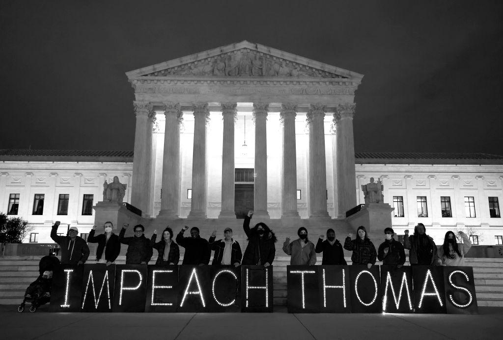 Protestors gather at a rally in Washington, D.C., to further the call to impeach Clarence Thomas