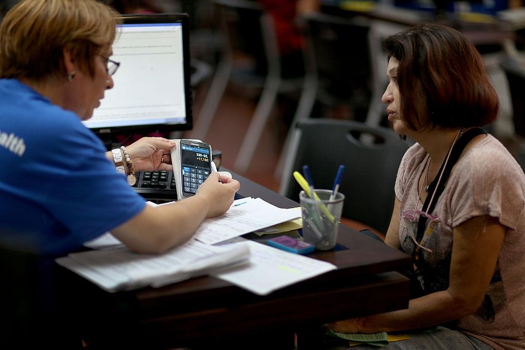 An insurance agent explaining a policy to a person