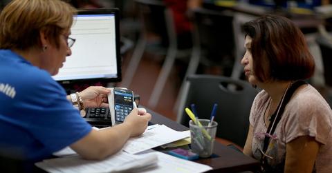 An insurance agent explaining a policy to a person
