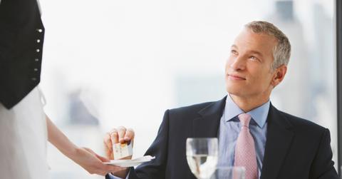 A man paying with a credit card