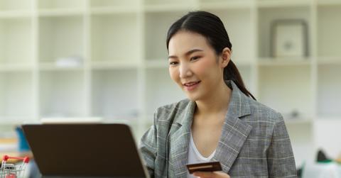 A woman using a credit card