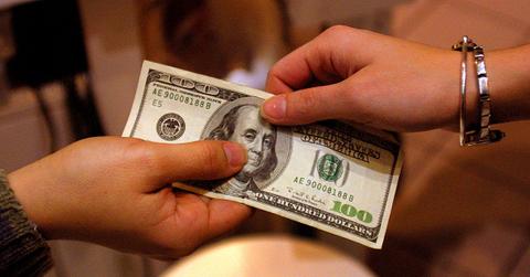 People exchanging $100