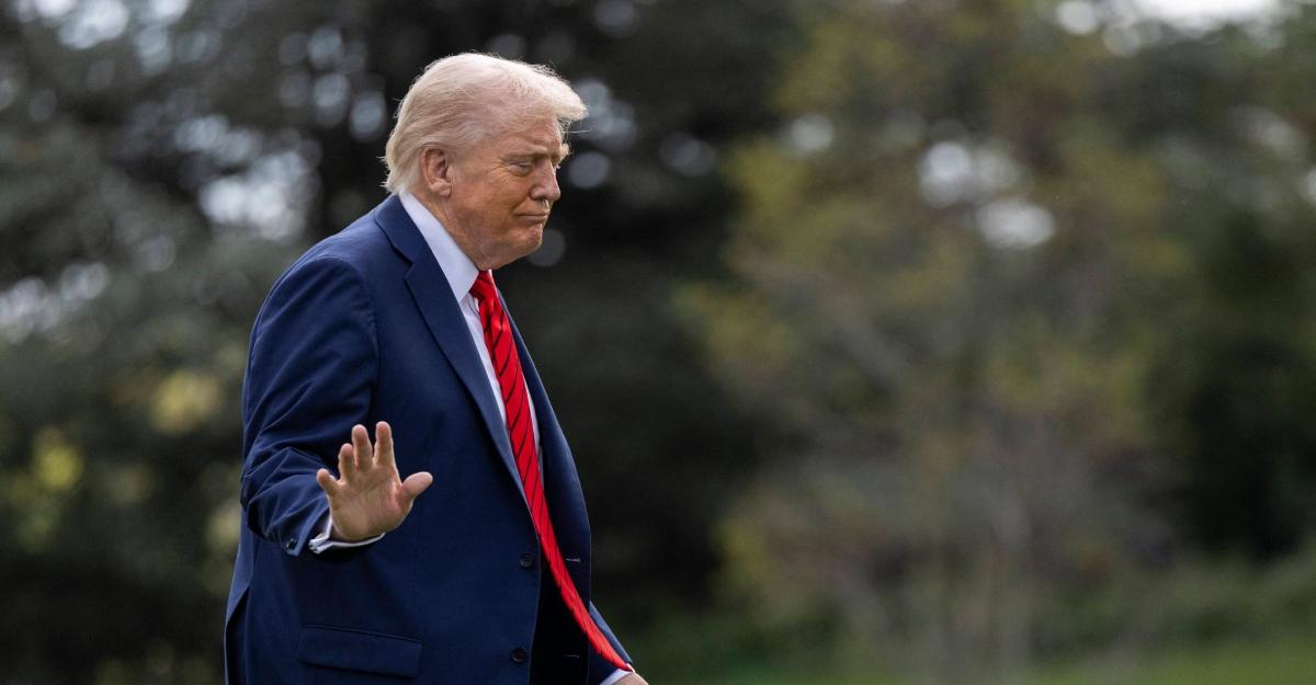 trump waves off photographer