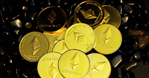 Ethereum coins on top of Black stones