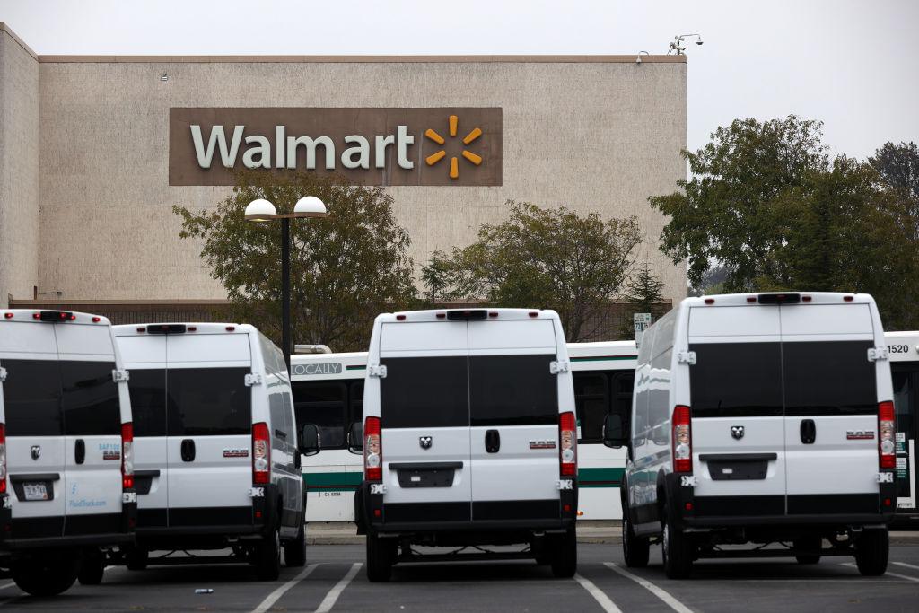 Walmart delivery vans in a parking lot