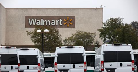 Walmart delivery vans in a parking lot