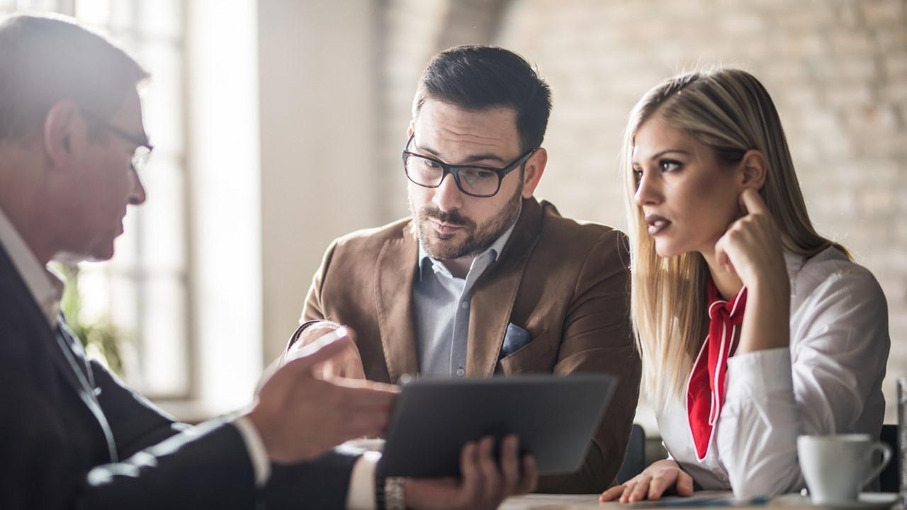 Couple talking to a financial planner