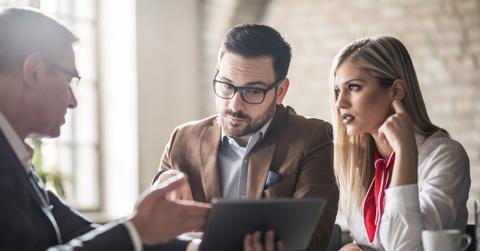Couple talking to a financial planner