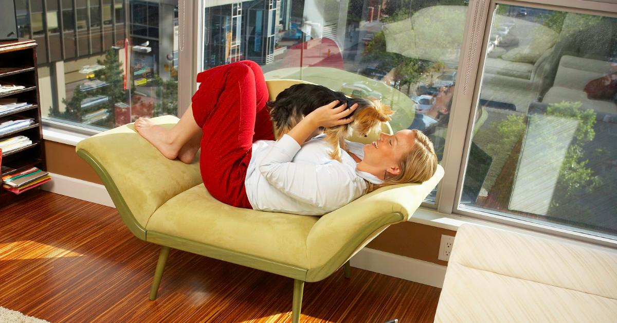 A woman and dog in a condo