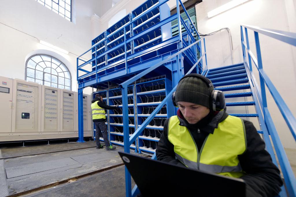 A crypto engineer checking mining equipment 