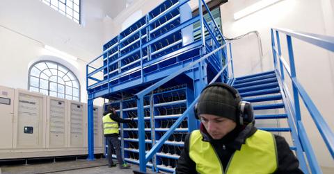 A crypto engineer checking mining equipment